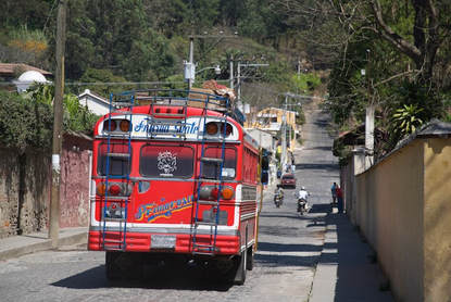 Bright red chicken bus in Antigua Guatemala