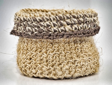 Hand-crocheted sisal basket trimmed with bronze fabric strips by zed handmade