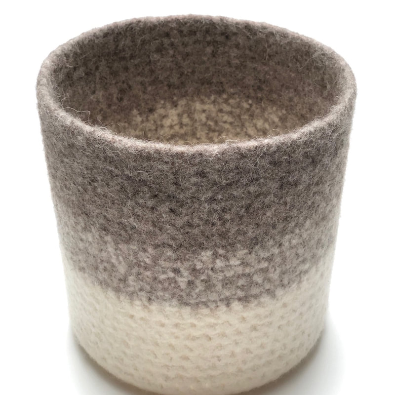 ALTO is a large tall two-coloured felted vessel 