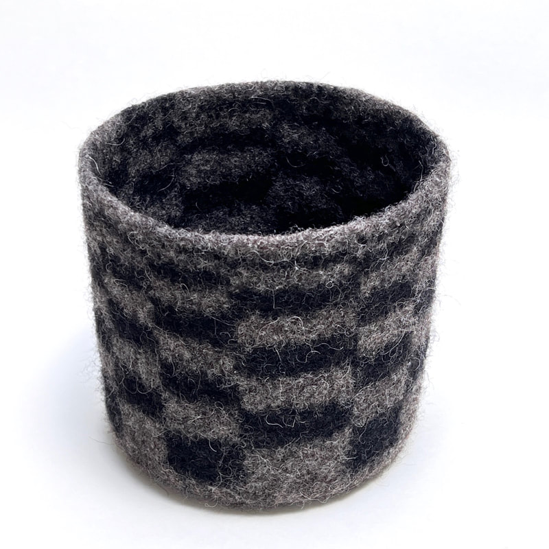 BOL Diminishing Returns is a hand felted  vessel in gunmetal with black diminishing rectangles from zedhandmade.com