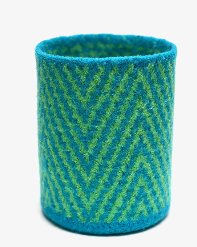 BOL Herringbone is a felted vessel with big chevrons of bright green and peacock
