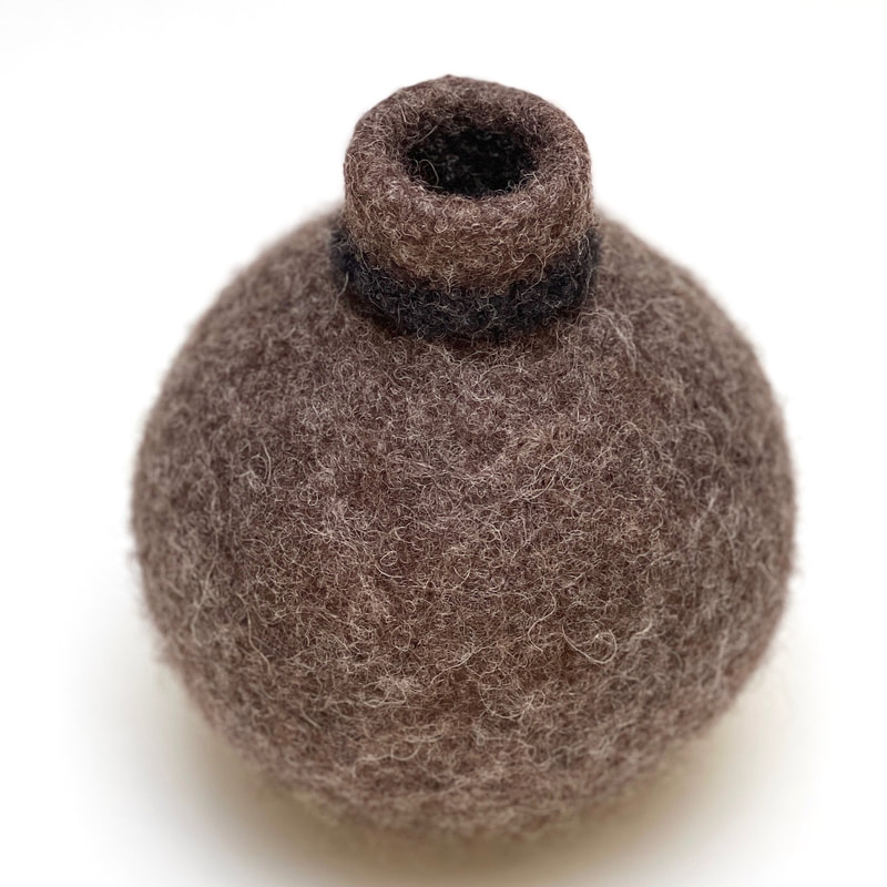 BOLA Black Collar is a small felted urn in undyed brown wool from zed handmade 