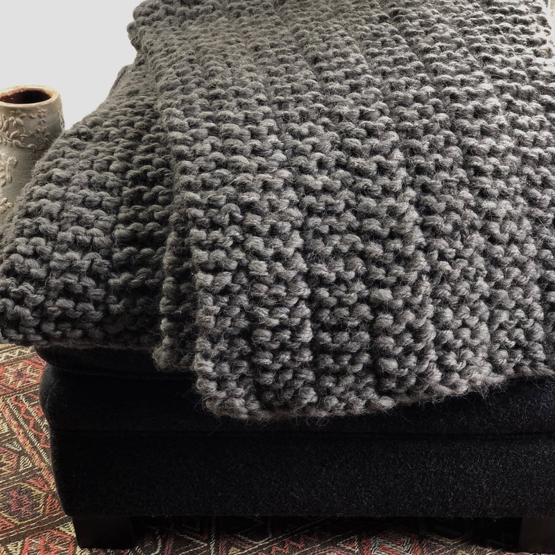 CLIFTON is a textured big-wool small blanket hand knit with Peruvian highland wool