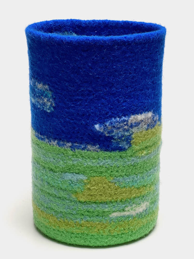 BOL Marshland is a tall felted vessel invoking the colors and textures of a marshy vista and sky