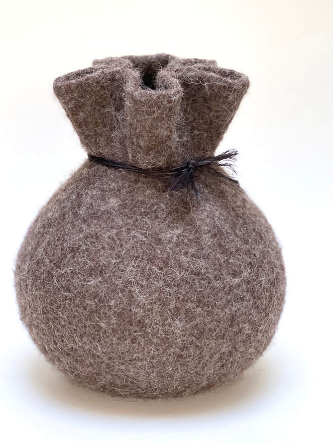 BOLA Gift Wrapped is a medium felted vessel rounded in shape with a gathered top in brown wool