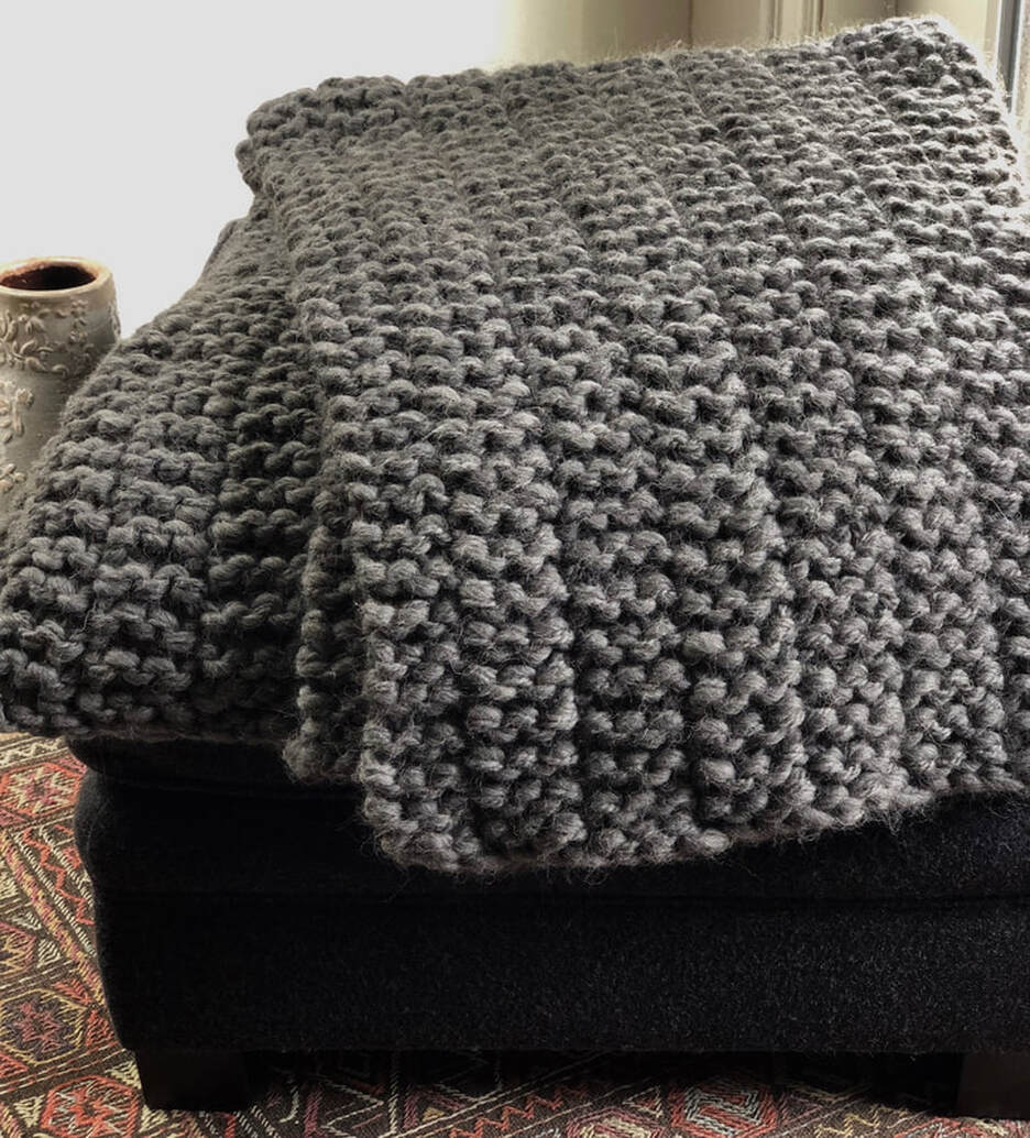 CLIFTON is a hand knit big-wool throw made with steel colored Peruvian highland wool by zed handmade