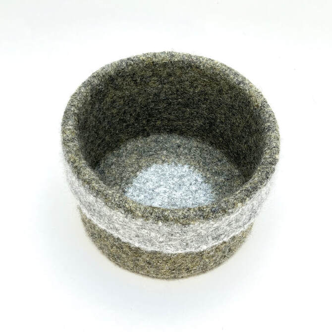 CUFF Moss on Stone medium felted straight-sided vessel in mossy green showing the sterling grey centre 